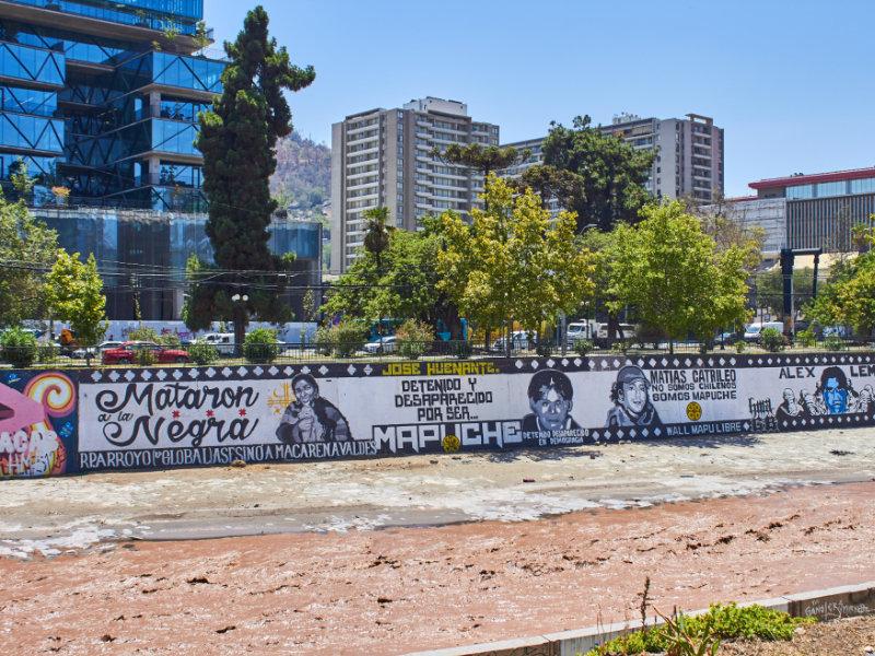 Protest artwork at the Mapocho River